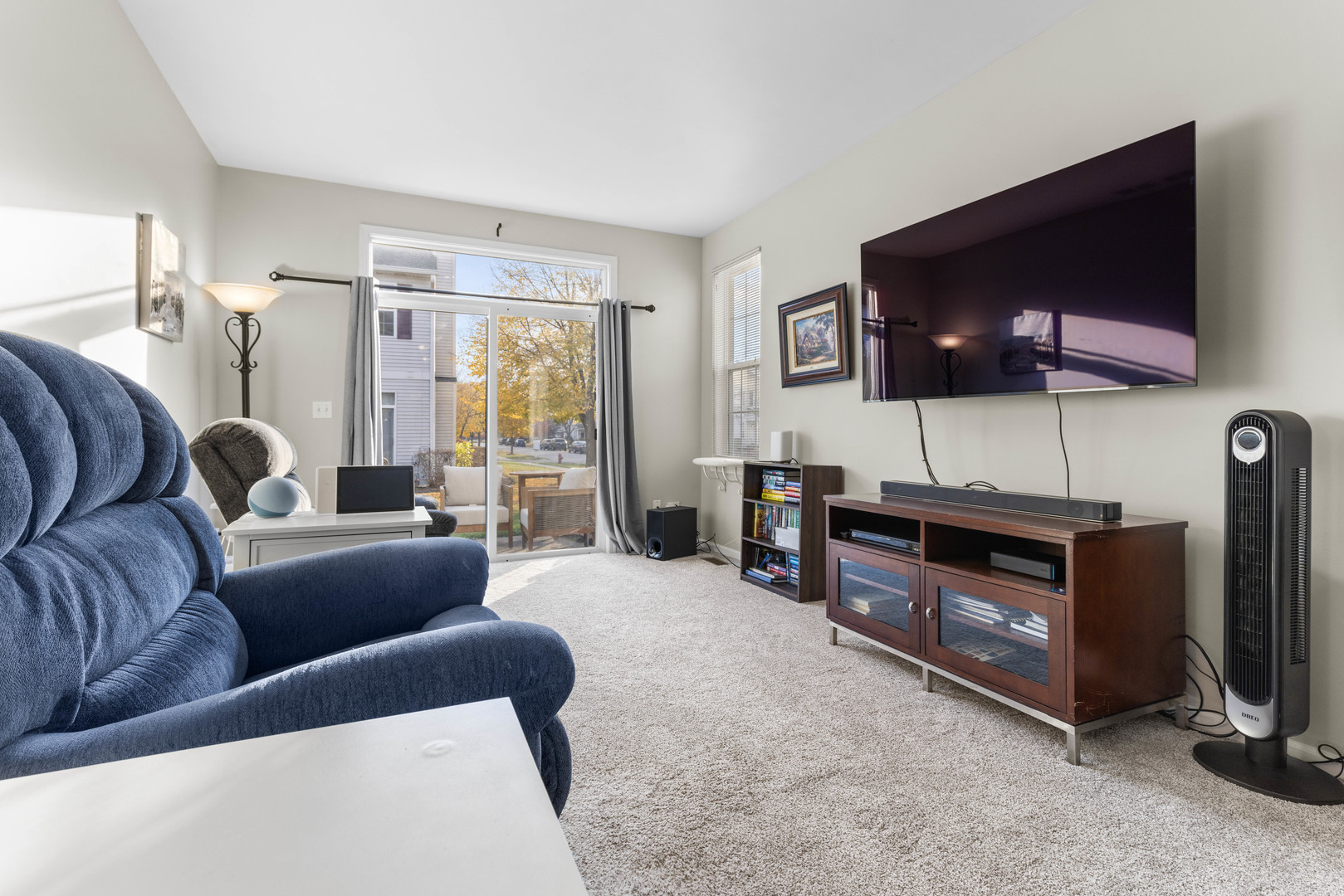 3133 Falling Waters Lane Lindenhurst, IL 60046 - Photo 8 of 15 a living room with furniture and a flat screen tv
