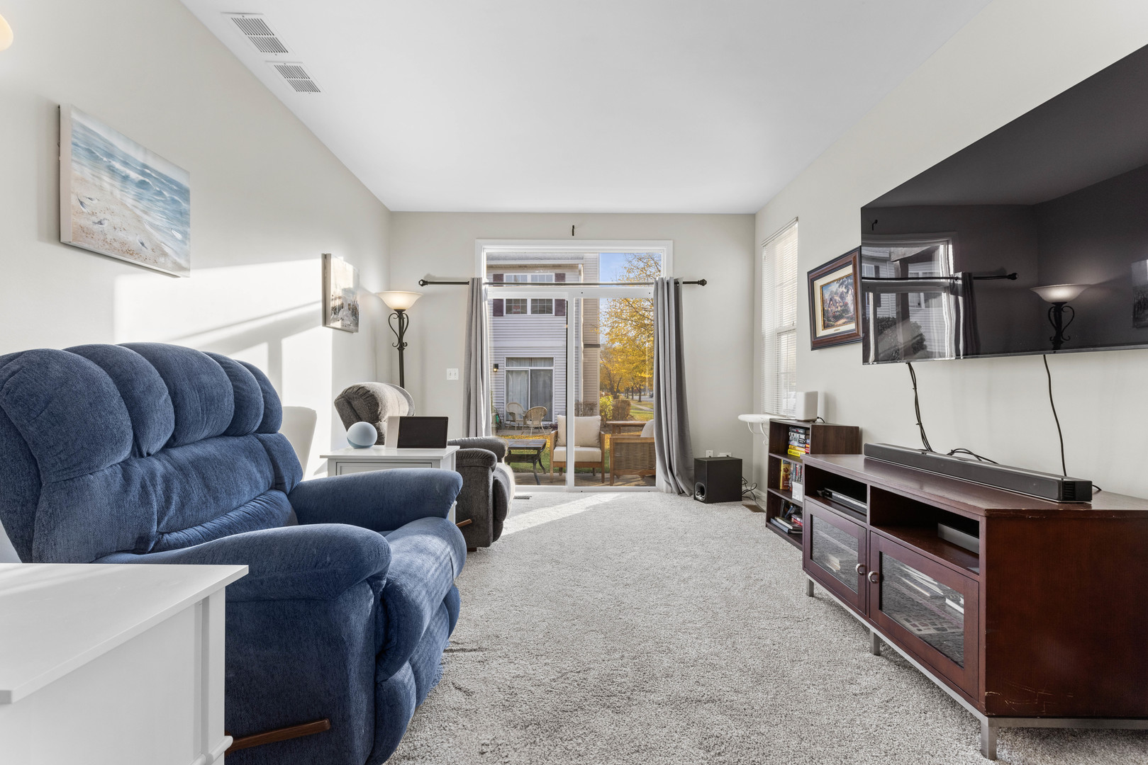 3133 Falling Waters Lane Lindenhurst, IL 60046 - Photo 9 of 15 a living room with furniture and a flat screen tv
