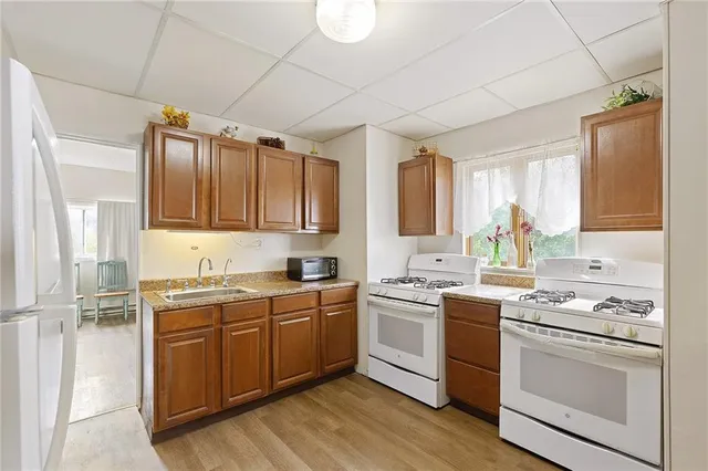 a kitchen with a sink cabinets and window