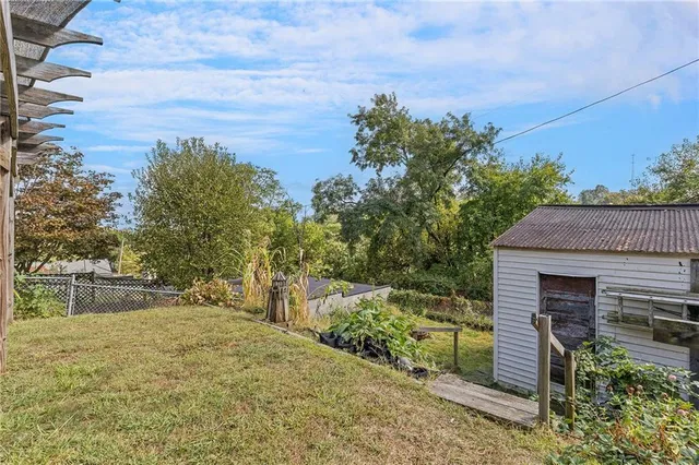 a backyard of a house with lots of green space