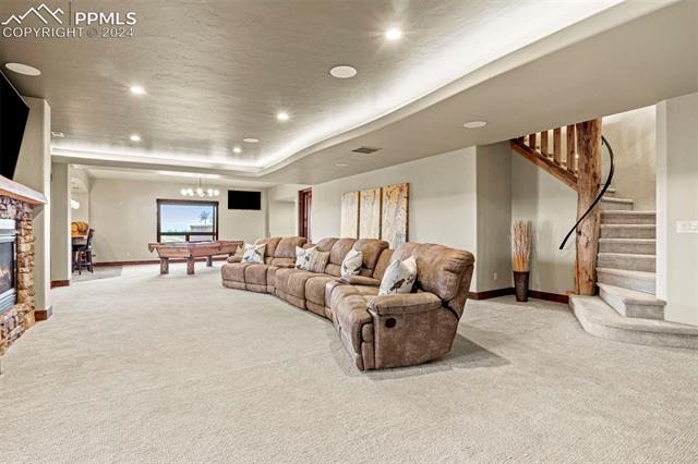 7115 Wildridge Road Colorado Springs, CO 80908 - Photo 39 of 49 Lower level living room with 2 walk outs