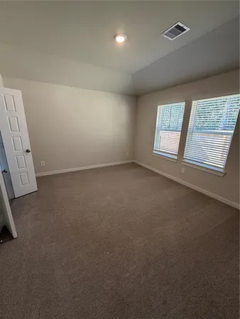 a spacious bathroom with a double vanity sink a mirror and a shower