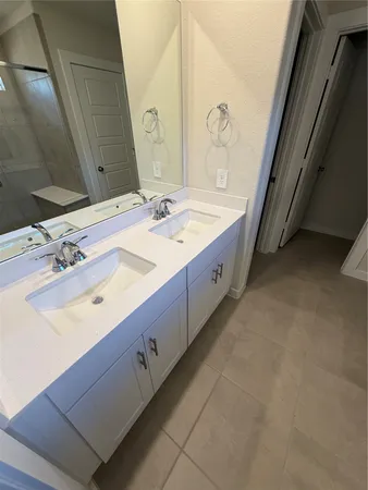 a kitchen with stainless steel appliances a refrigerator and a stove top oven