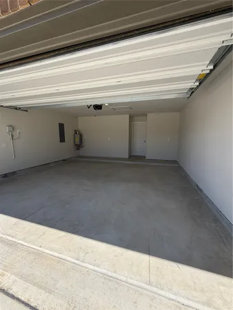 a view of a livingroom with a window and wooden floor