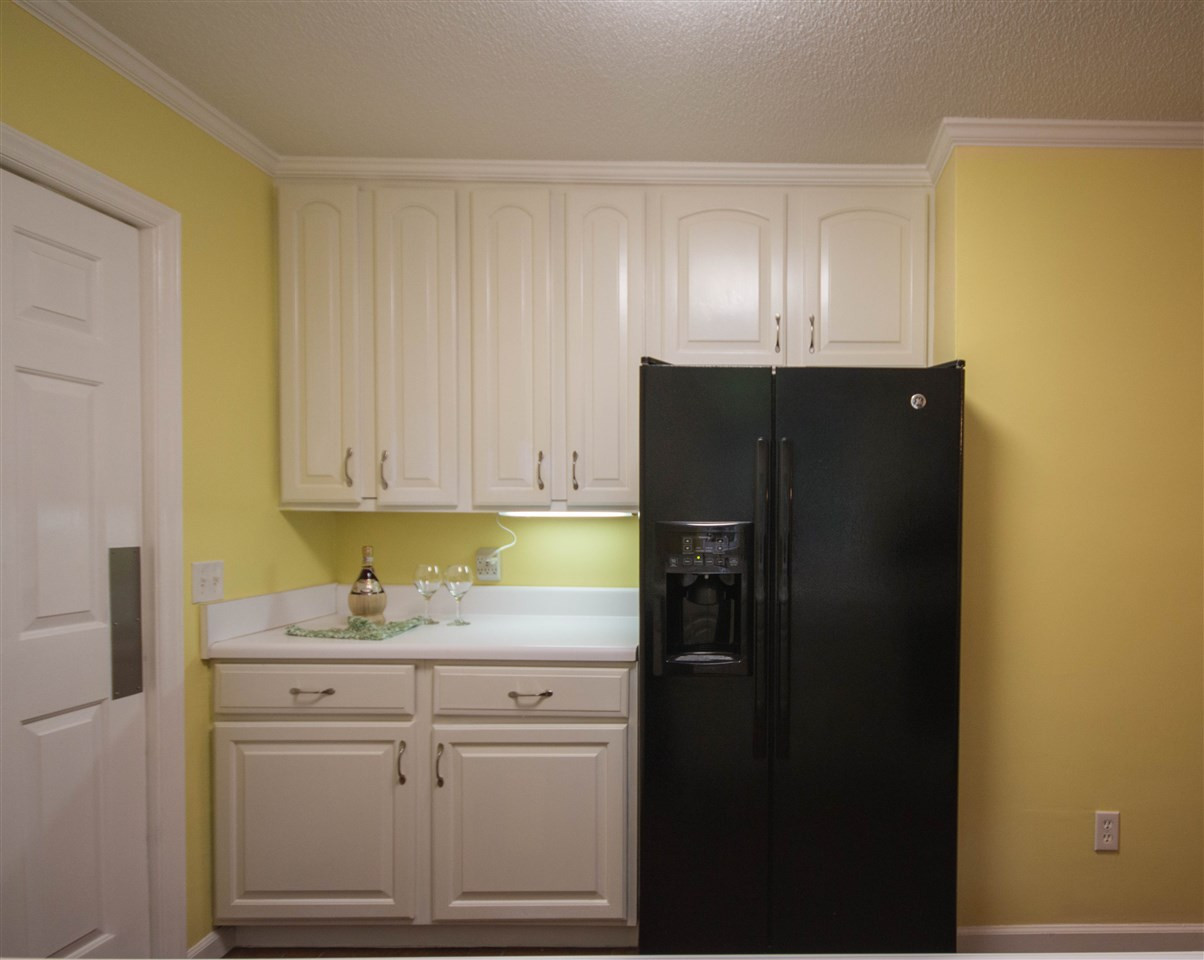 7626 Herndon Road Durham, NC 27713 - Photo 12 of 25 The side by side refrigerator/freezer is adjacent to additional cabinetry and countertop. The is also a pantry next to the Breakfast Area. Kitchen