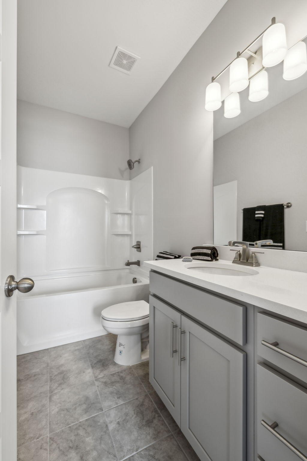 300 Carver Connection Lebanon, TN 37087 - Photo 30 of 36 a bathroom with a toilet a sink a large mirror and vanity