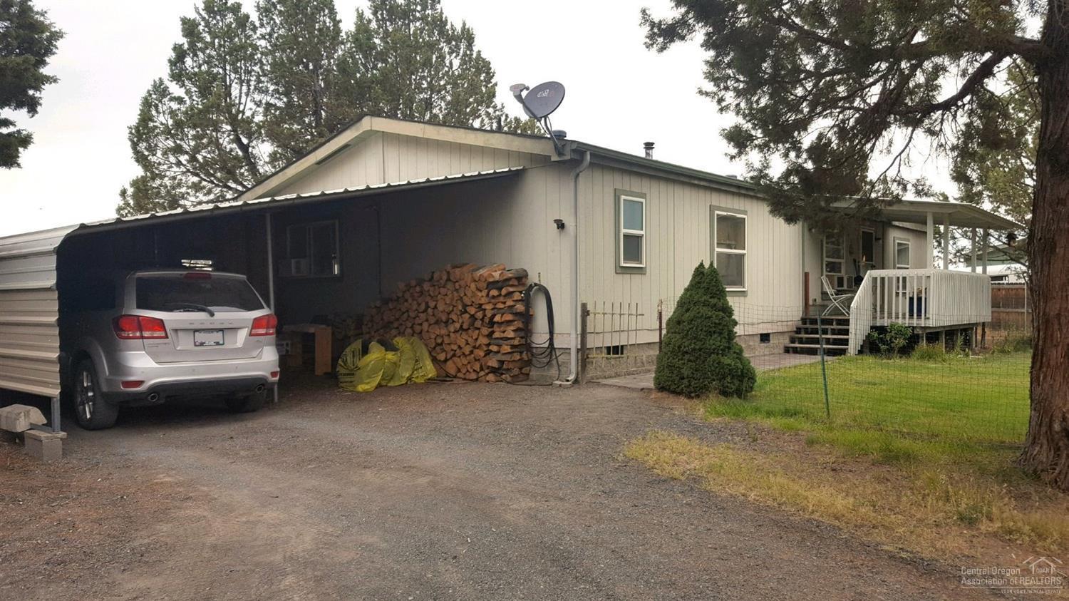 8518 Southwest Crater Loop Road Terrebonne, OR 97760 - Photo 2 of 24 Carport & Front of home.