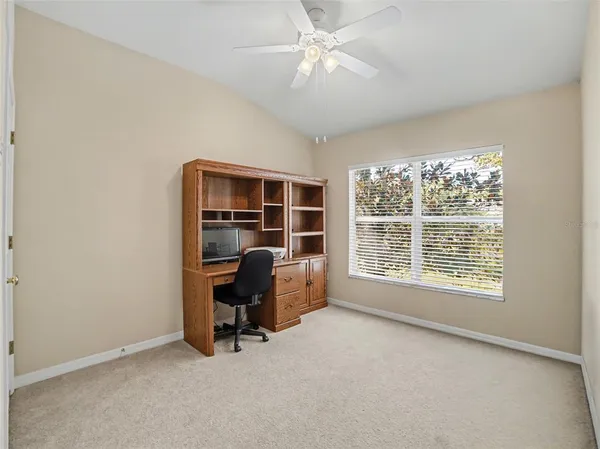 a view of workspace with furniture and a window