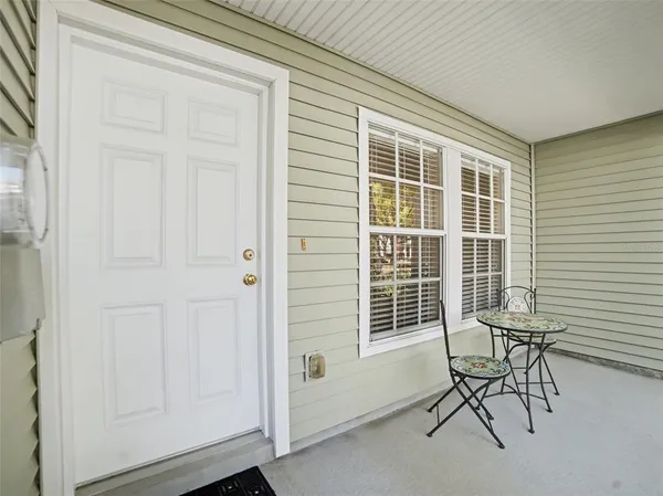 a view of a livingroom with chair and the door
