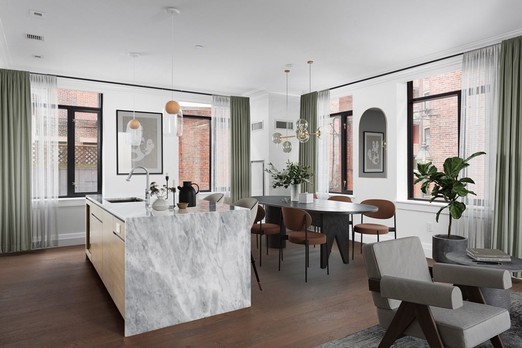 45 Temple Street, Unit 102 Boston, MA 02114 - Photo 1 of 15 a living room with furniture and a large window