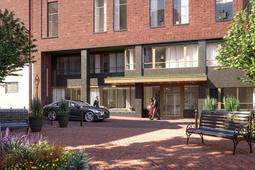 45 Temple Street, Unit 102 Boston, MA 02114 - Photo 15 of 15 a car parked in front of a brick building