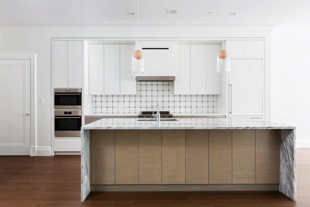 45 Temple Street, Unit 102 Boston, MA 02114 - Photo 2 of 15 a kitchen with stainless steel appliances a sink and cabinets