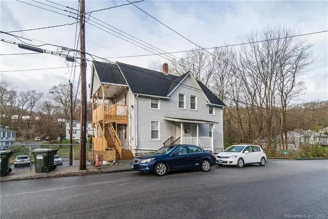 a car parked in front of a house