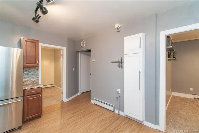 an empty room with windows and closet