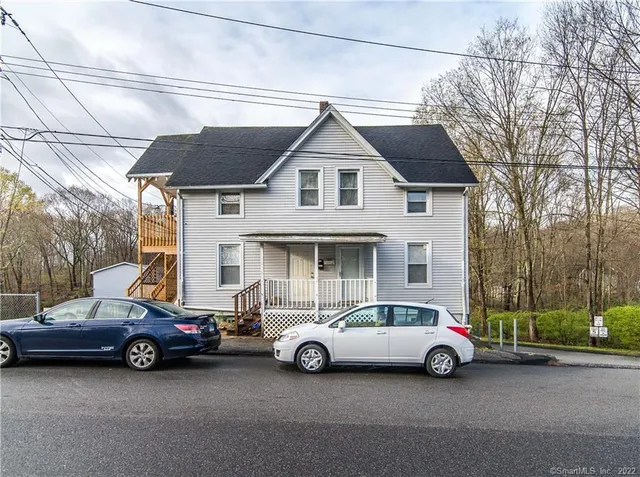 an aerial view of a house with outdoor space