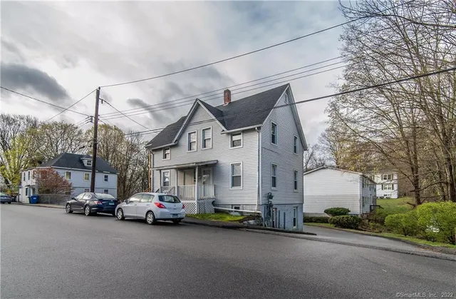 a view of a cars park in front of house