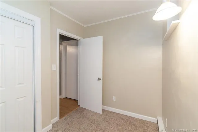 a view of a livingroom with furniture and a window