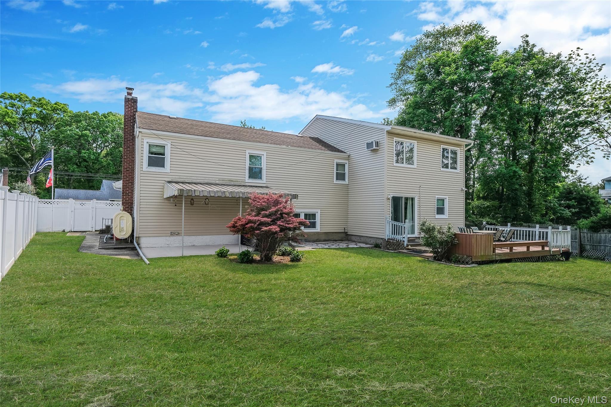 59 Maybrook Road North Babylon, NY 11703 - Photo 37 of 43 a view of a house with backyard sitting area and garden