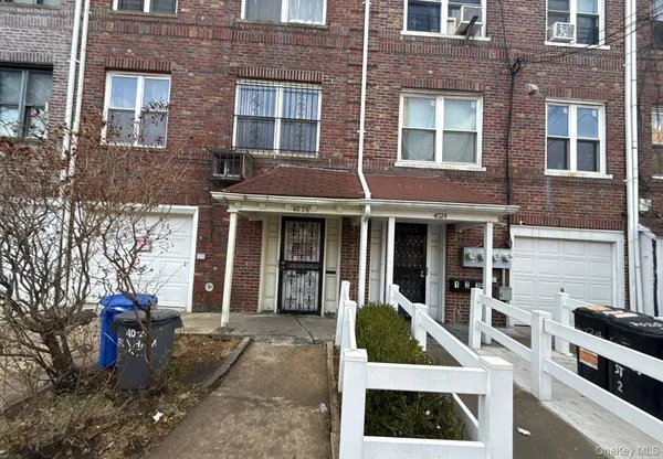 a view of a brick building with many windows