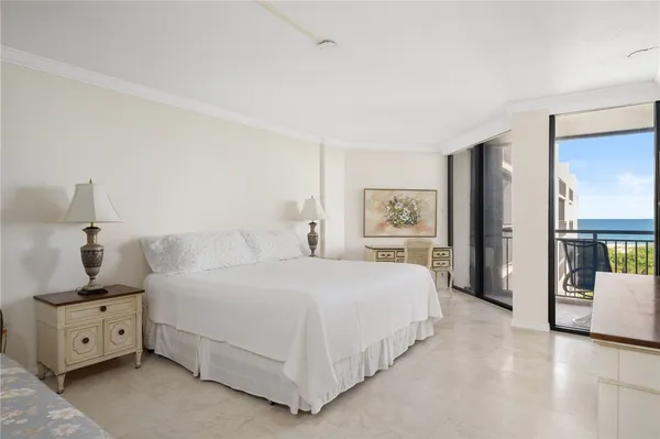 a bedroom with a large bed and a table