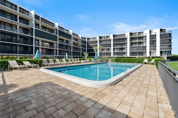 a view of a swimming pool with a patio
