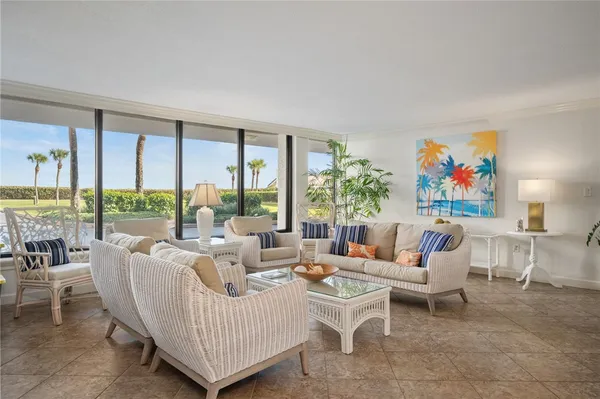 a living room with furniture and a large window