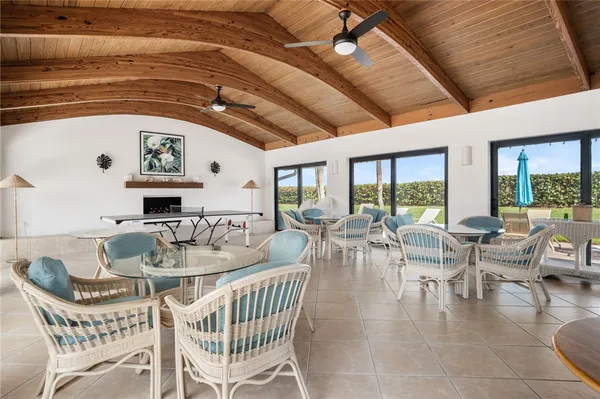 a dining room with furniture window and outside view