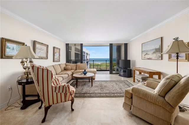 a living room with furniture a lamp and a window
