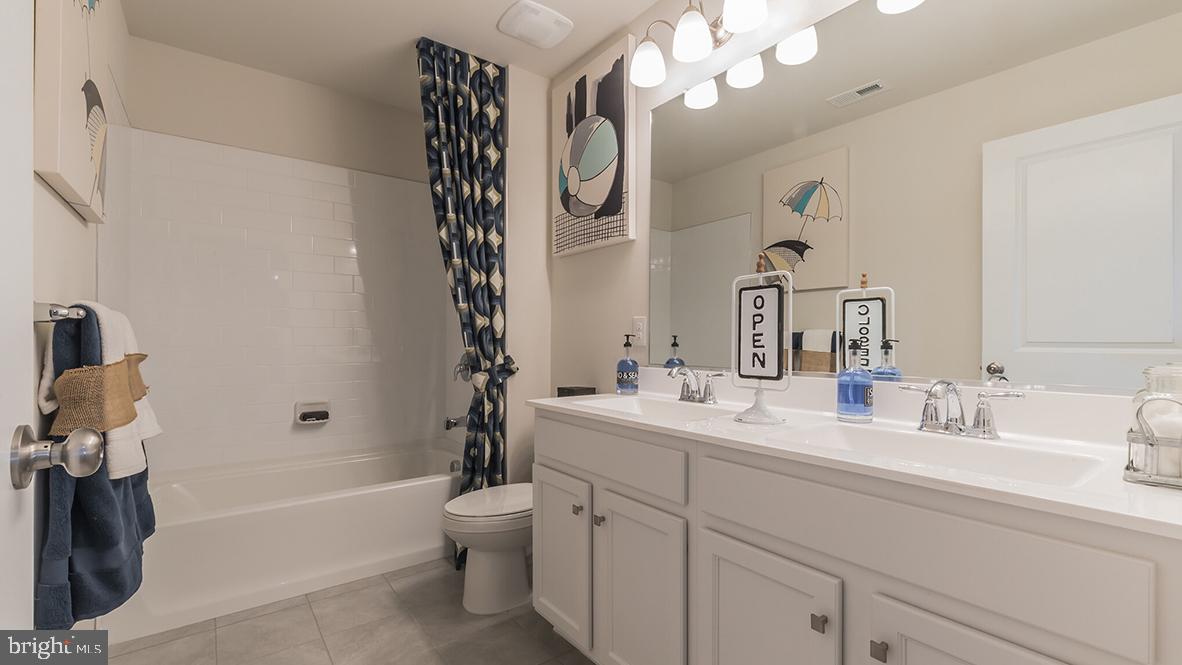2 Georgetown Drive Freehold, NJ 07728 - Photo 18 of 24 a bathroom with a sink a toilet and a bathtub
