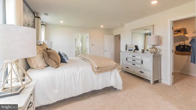 a bedroom with a bed and a cabinets