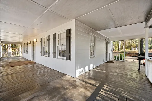 a view of an entryway with wooden floor