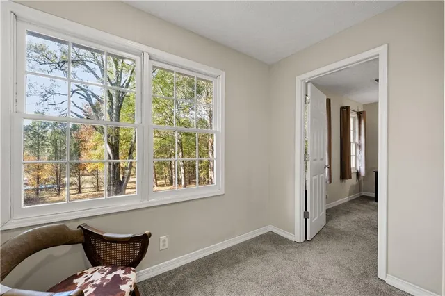 a very nice looking room with a large window and a lake view