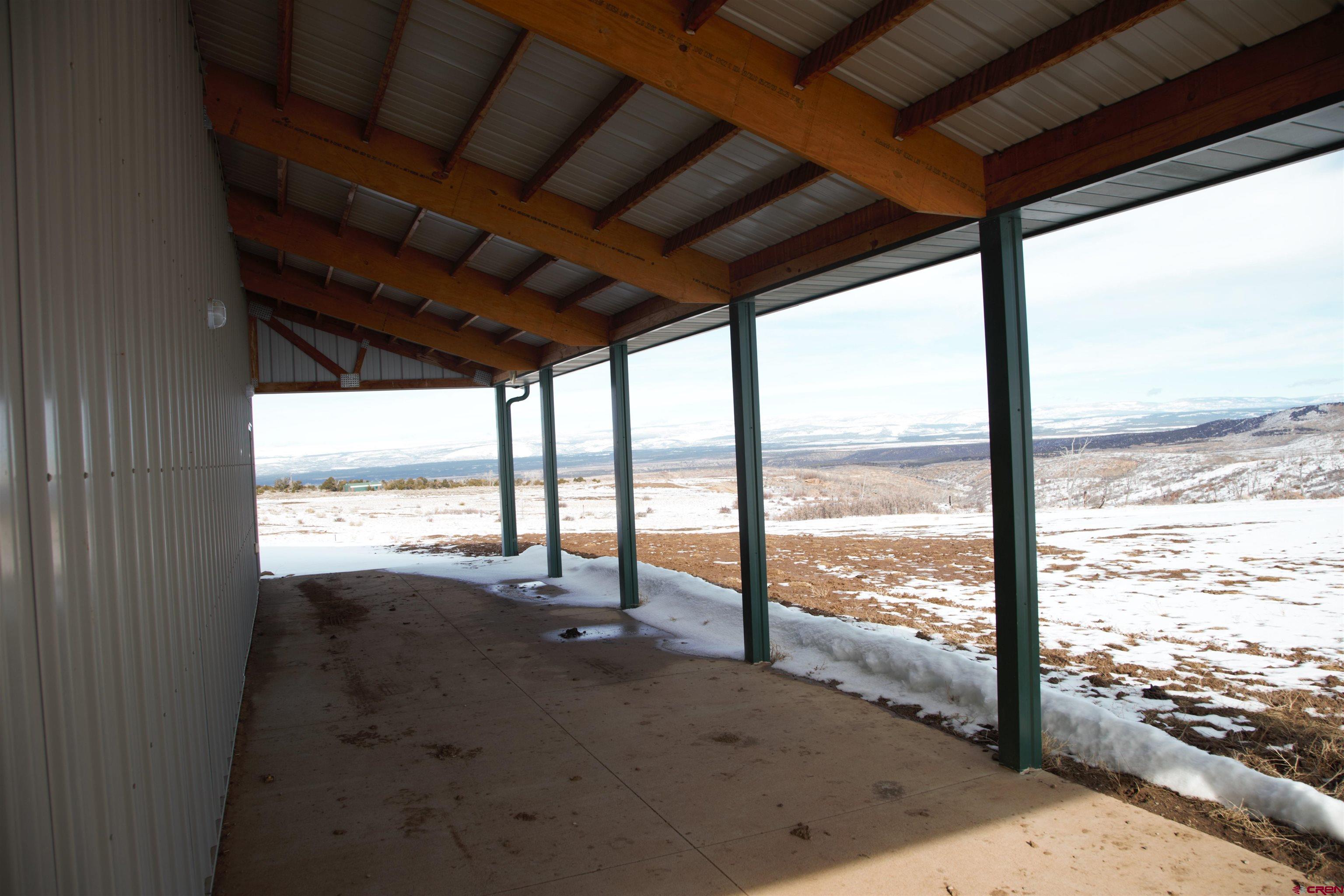 6998 East County Road U 29 Redvale, CO 81431 - Photo 18 of 27 a view of an ocean and a floor to ceiling window