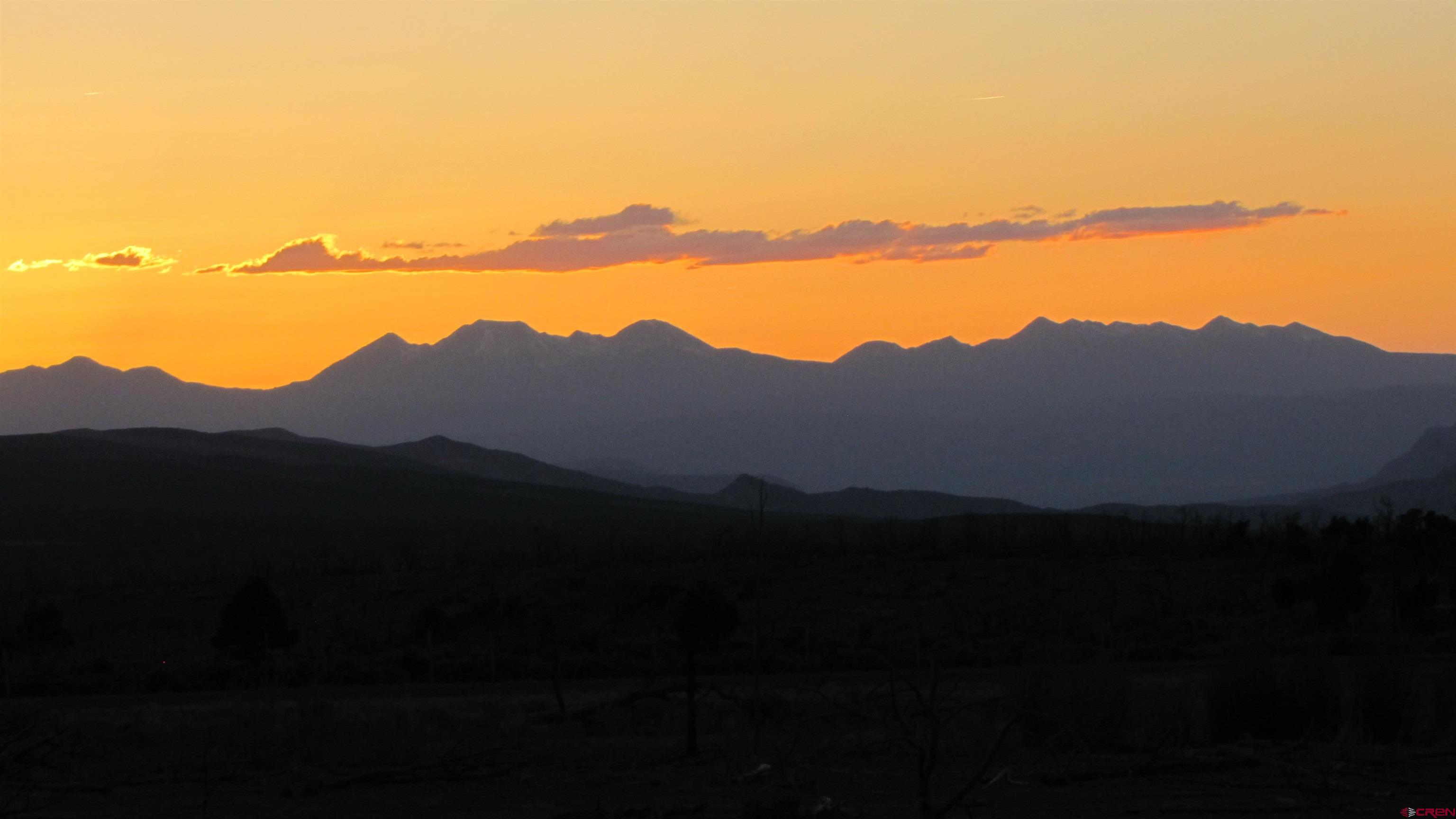 6998 East County Road U 29 Redvale, CO 81431 - Photo 2 of 27 a view of a lake with a mountain