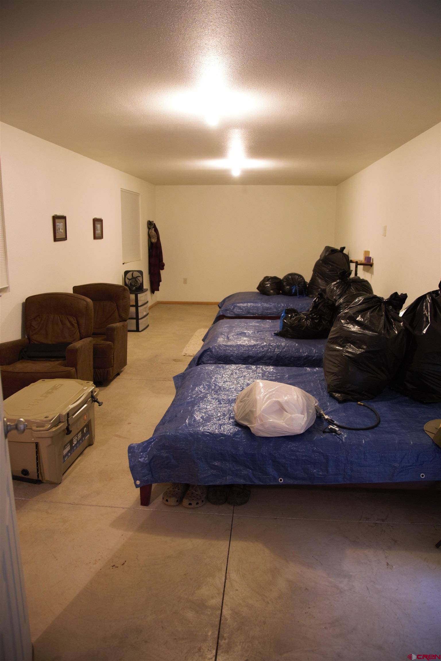 6998 East County Road U 29 Redvale, CO 81431 - Photo 21 of 27 a living room with furniture and a couch