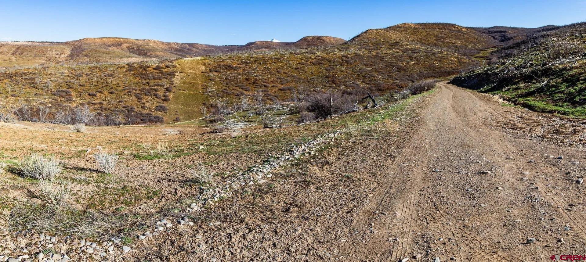 6998 East County Road U 29 Redvale, CO 81431 - Photo 9 of 27 a view of a field with a mountain in the background