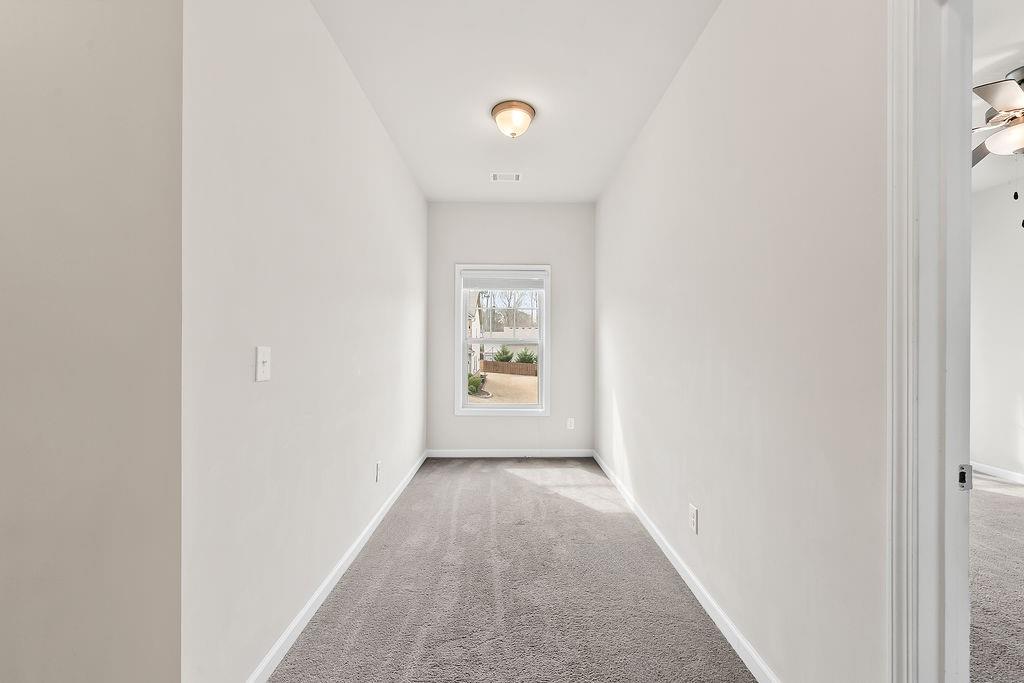 2415 Matlin Way Buford, GA 30519 - Photo 36 of 65 a view of a hallway with a window