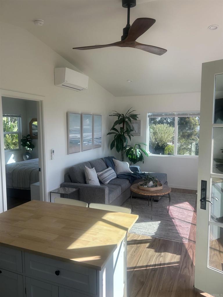 337-2 South Barnwell Street Oceanside, CA 92054 - Photo 12 of 21 a bedroom with a bed and a chandelier