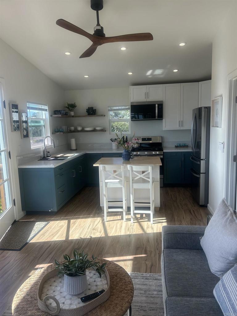 337-2 South Barnwell Street Oceanside, CA 92054 - Photo 13 of 21 a kitchen with stainless steel appliances granite countertop a stove and a refrigerator