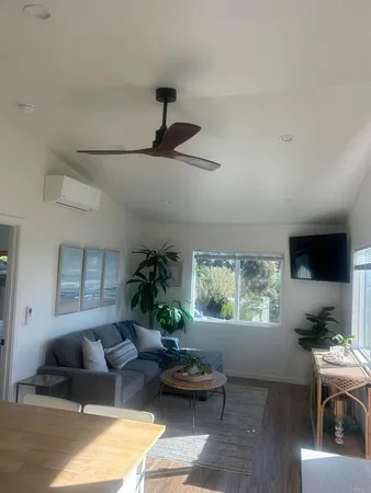 a living room with furniture and a window