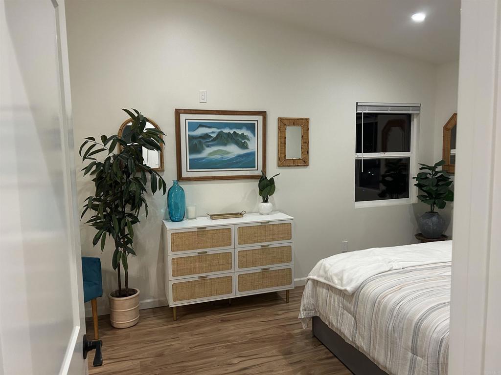 337-2 South Barnwell Street Oceanside, CA 92054 - Photo 18 of 21 a bedroom with a bed and a potted plant