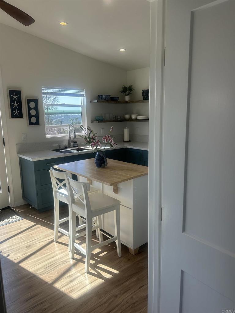 337-2 South Barnwell Street Oceanside, CA 92054 - Photo 9 of 21 a kitchen with a table and chairs in it