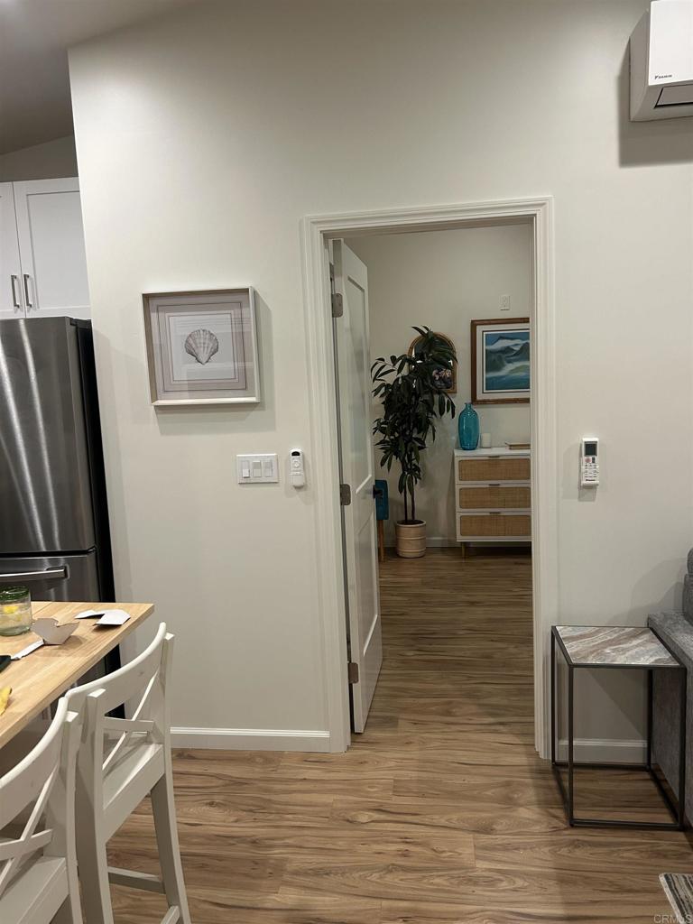 337-2 South Barnwell Street Oceanside, CA 92054 - Photo 10 of 21 a view of a workspace with furniture and wooden floor