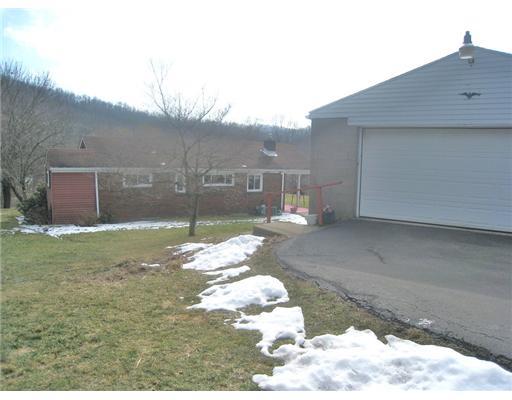 7808 Noblestown Road McDonald, PA 15057 - Photo 13 of 14 Exterior Back. Convenient parking in the back. Great for bringing groceries right into the kitchen.
