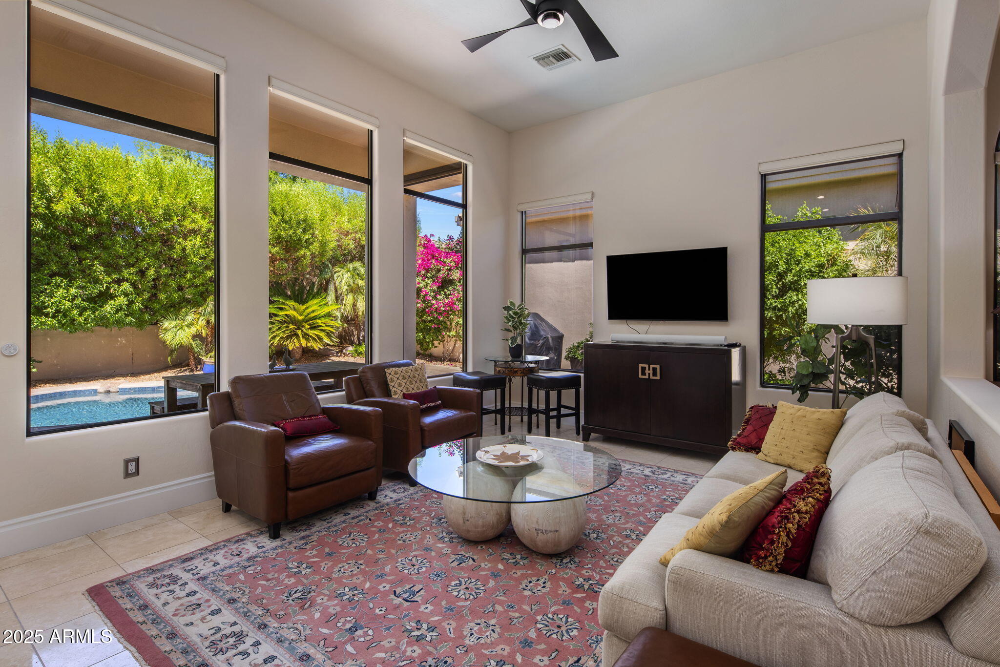 8216 East Angel Spirit Drive Scottsdale, AZ 85255 - Photo 13 of 29 a living room with furniture and a flat screen tv