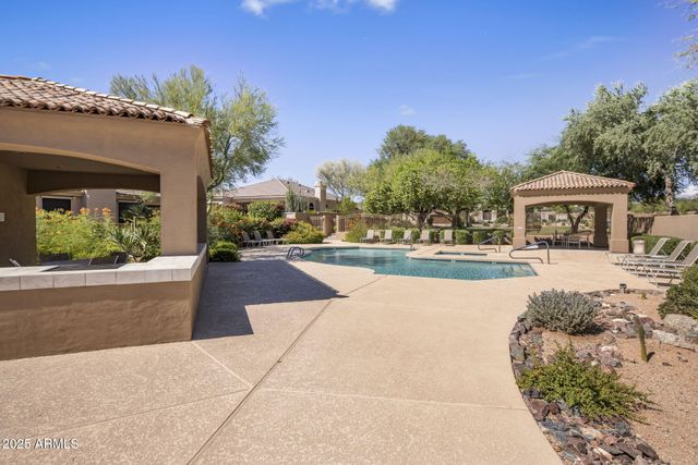 a view of a backyard and patio