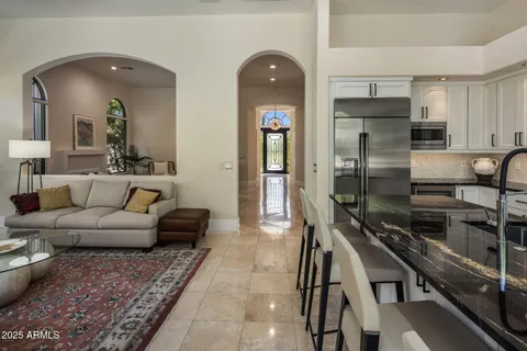 a living room with furniture and a stove