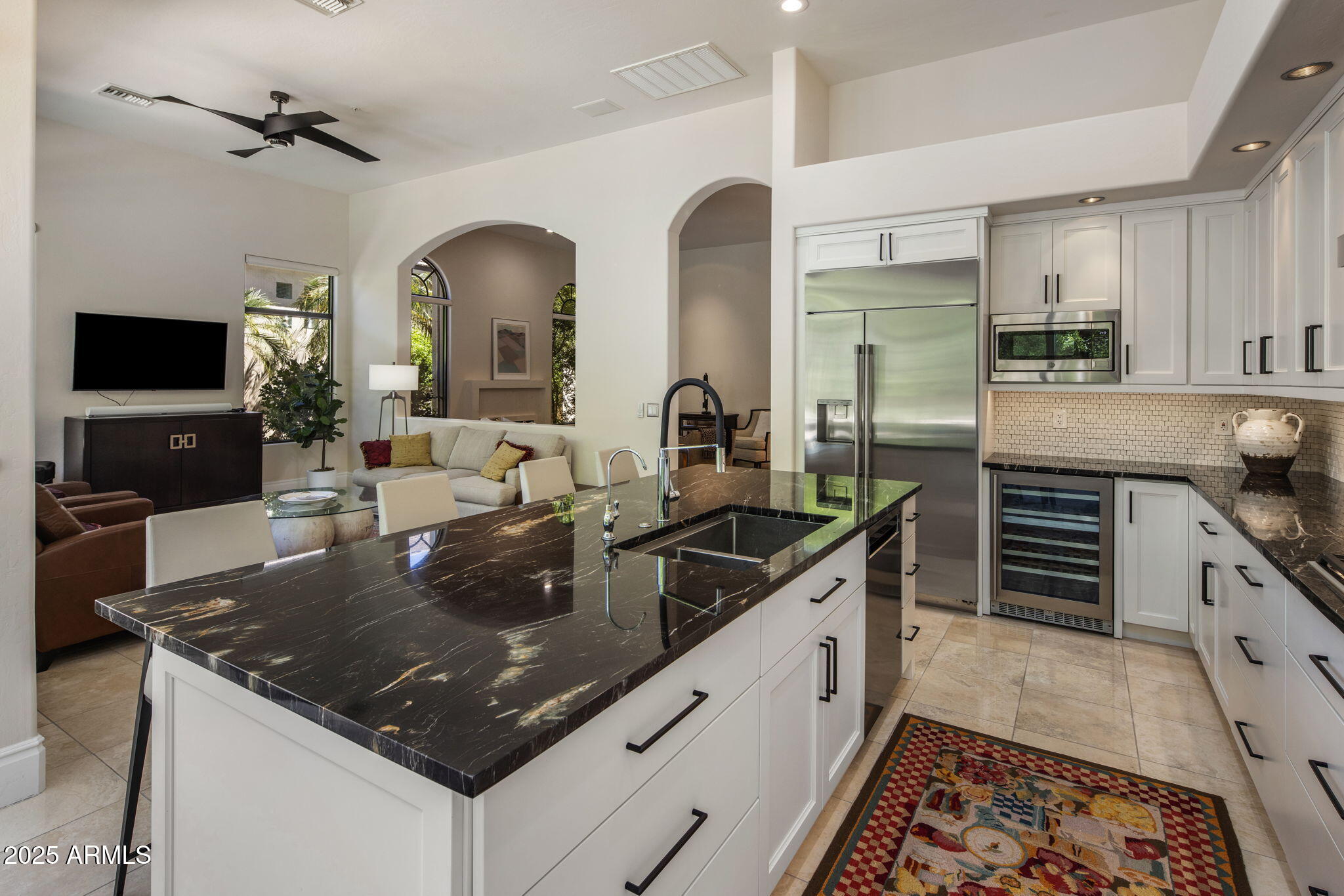 8216 East Angel Spirit Drive Scottsdale, AZ 85255 - Photo 9 of 29 a kitchen with stainless steel appliances granite countertop a sink stove and cabinets