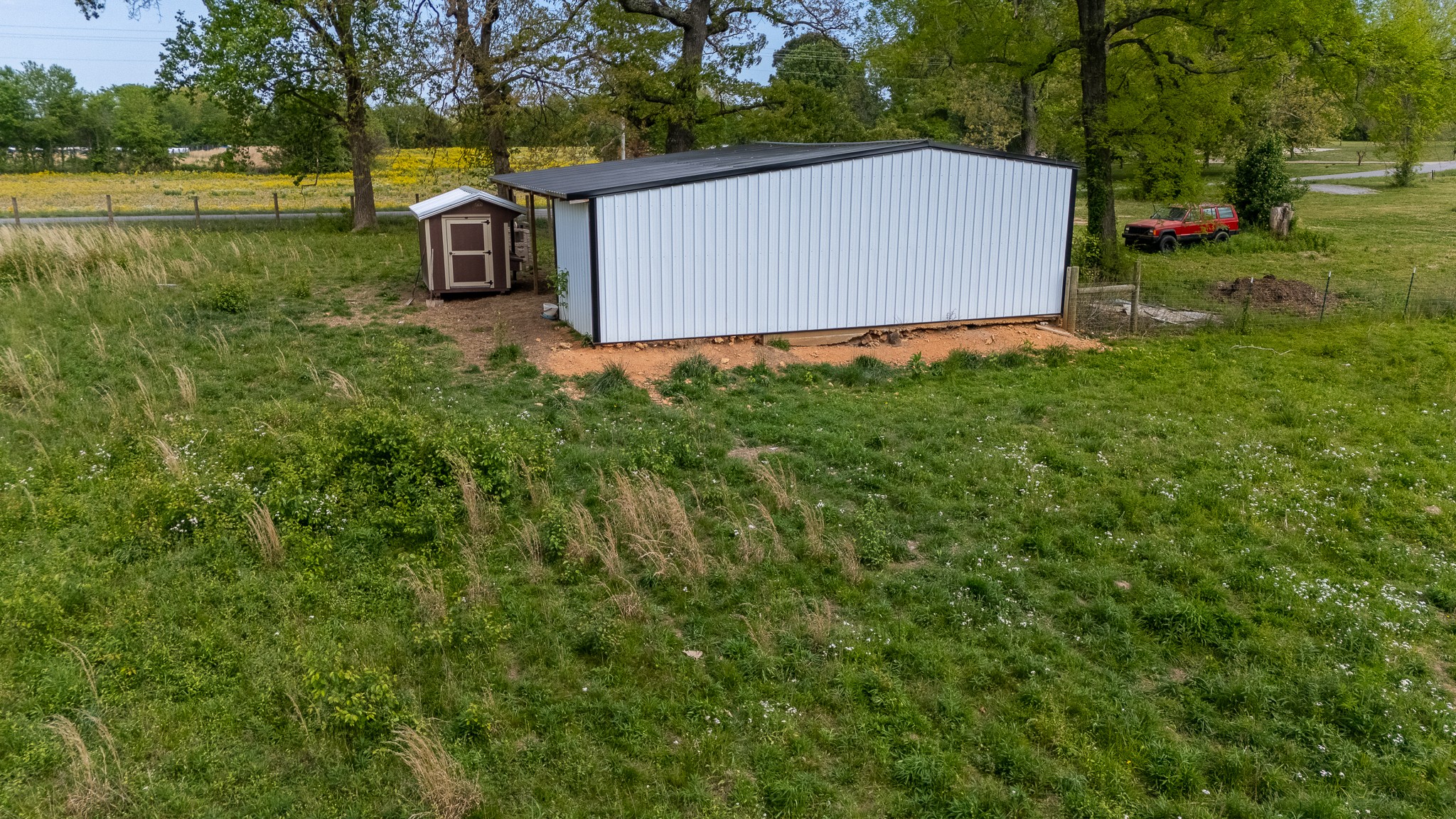 521 Revilo Road Leoma, TN 38468 - Photo 8 of 14 a view of a park with a bench and trees