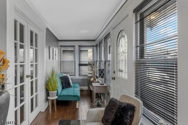 a balcony with furniture and wooden floor